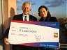 Milou Halbesma presents €1,000,000 to Kommer Braber, manager of the Leprosy Foundation
