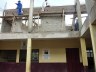 Lessons have started downstairs, while a second floor is built on top of the school. Turing Project Visit, March 2012.